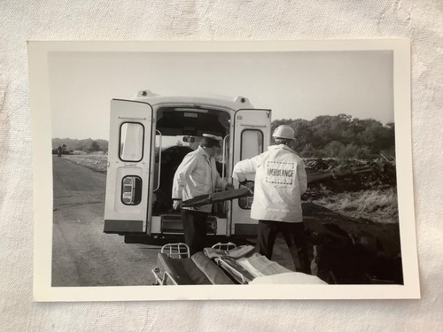 Two ambulance workers - , carrying